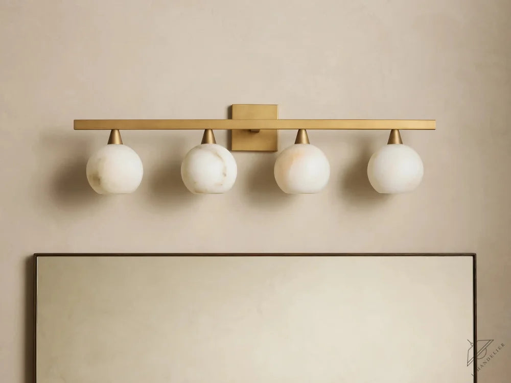 ichandelier Arica 4-Light Sconce, modern brass finish with white marble globes, ideal for bathrooms.
