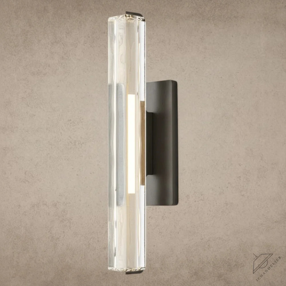 ichandelier Audubon Crystal Single Sconce, clear glass cylinder with textured interior, mounted on dark metal base