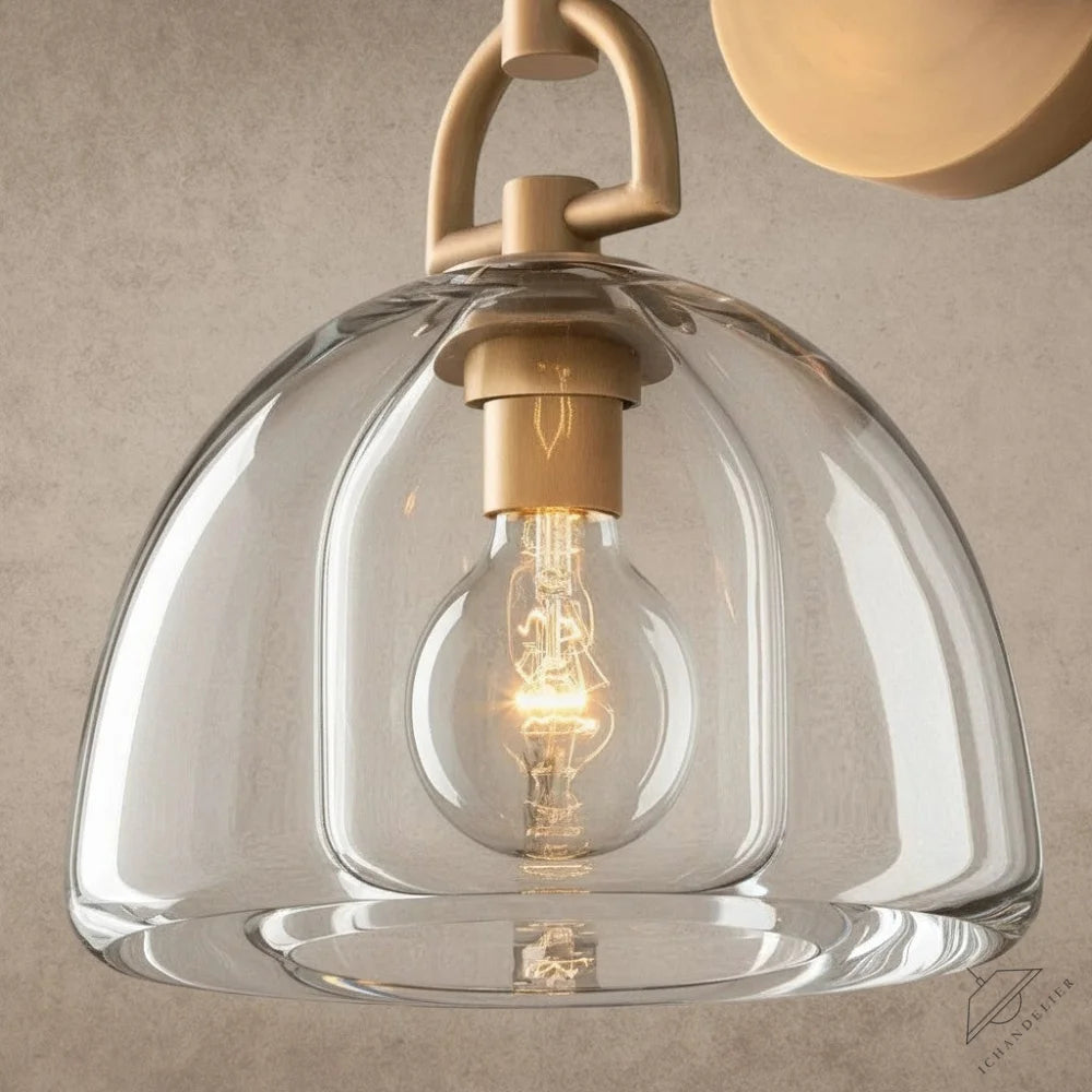 ichandelier Botanist Dome Sconce, clear glass shade with brass hardware and exposed Edison bulb