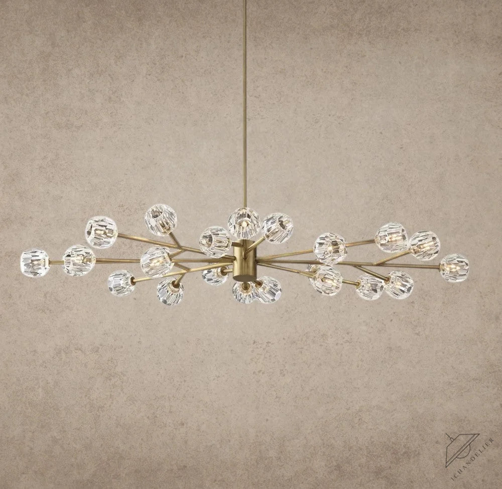 Modern chandelier with gold and crystal design on a gray background