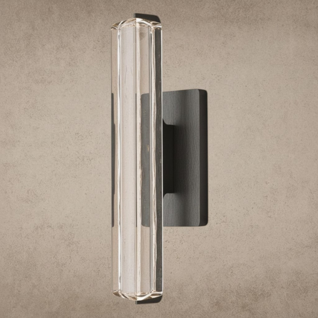 ichandelier Audubon Crystal Single Sconce, clear glass cylinder with faceted details, mounted on dark metal base.