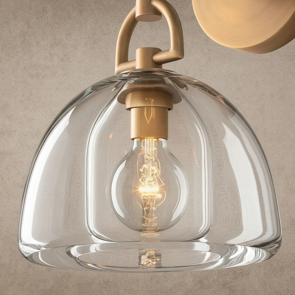 ichandelier Botanist Dome Sconce, clear glass shade with brass hardware and exposed Edison bulb