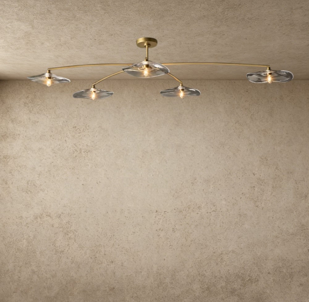 ichandelier Lily collection flushmount light with clear glass petal shades and brass frame.