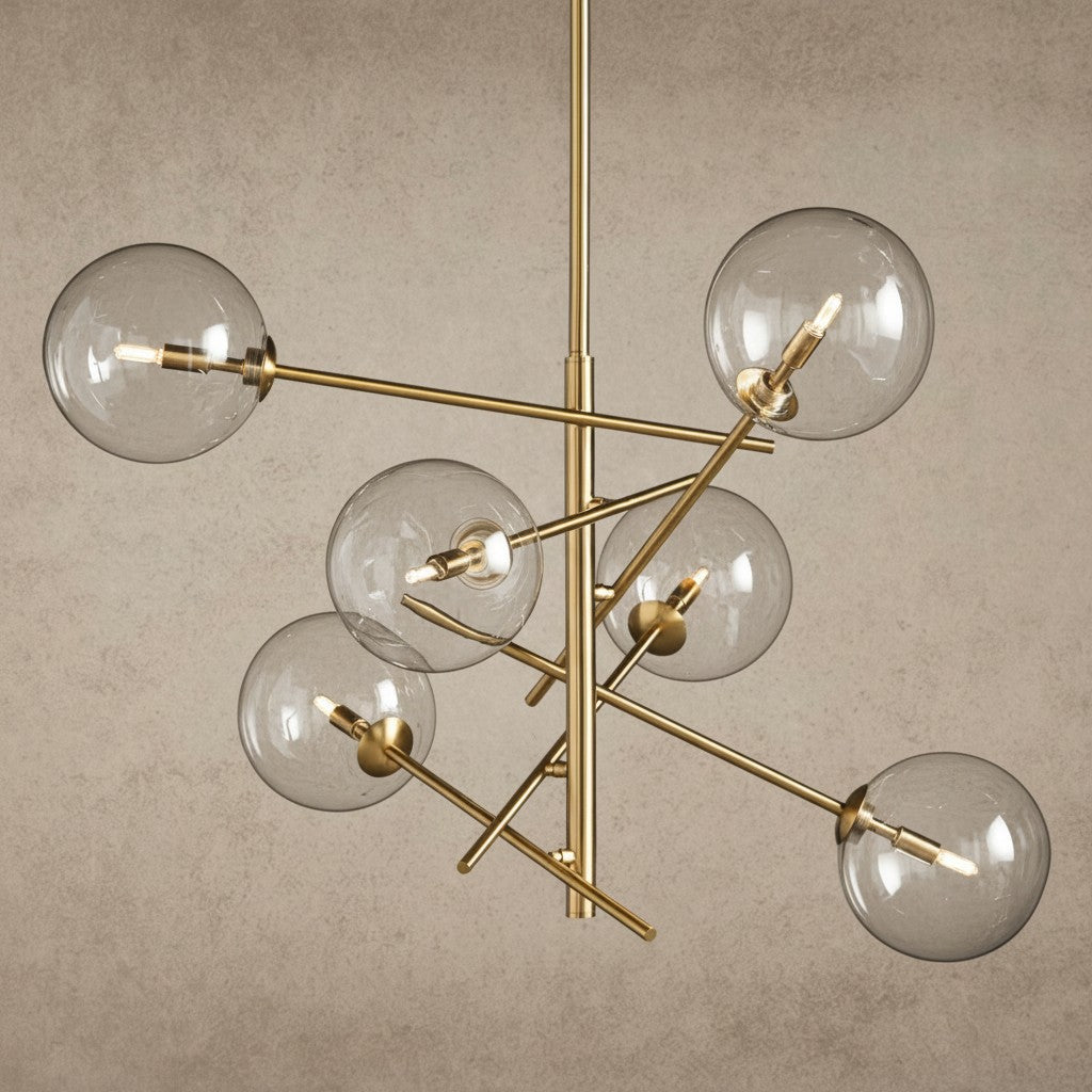 ichandelier Roscoe Chandelier, modern brass fixture with clear glass globe shades and exposed bulbs.