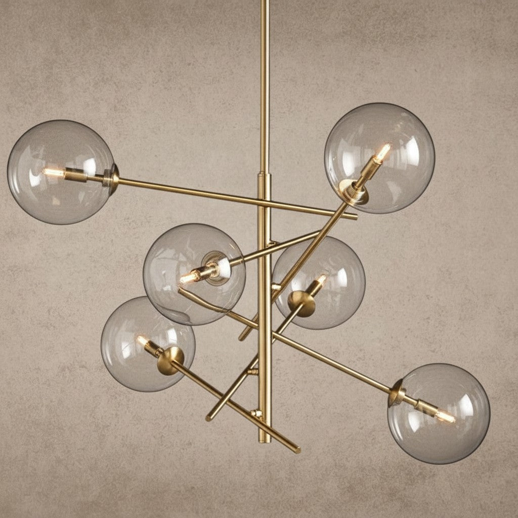 ichandelier Roscoe Chandelier with clear glass globes and brass metal frame, modern abstract design.