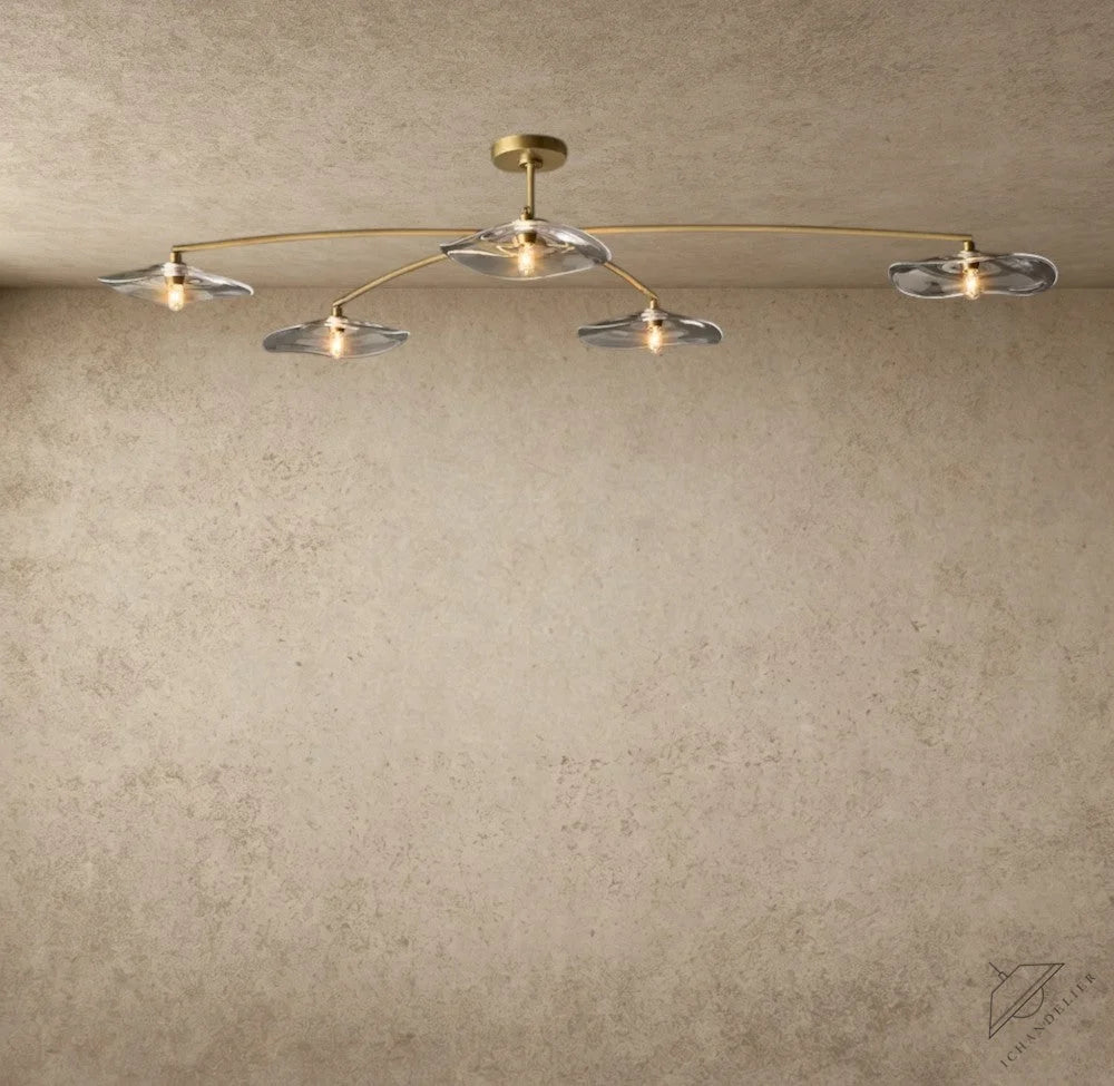 ichandelier Lily collection flushmount light with clear glass petal shades and brass frame.