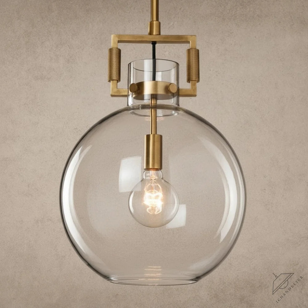 ichandelier Machinist-Glass-Globe-Pendant, a clear glass globe pendant light with brass hardware and exposed Edison bulb.