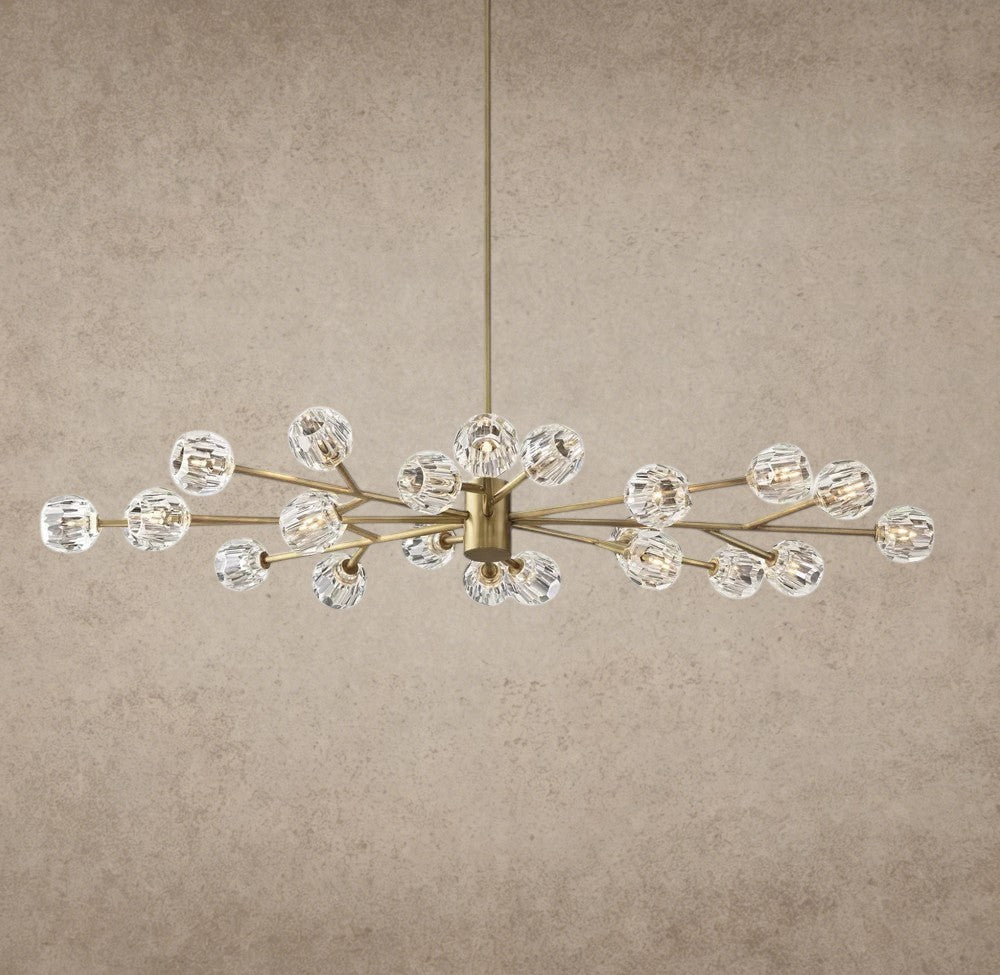 Modern chandelier with gold and crystal design on a gray background