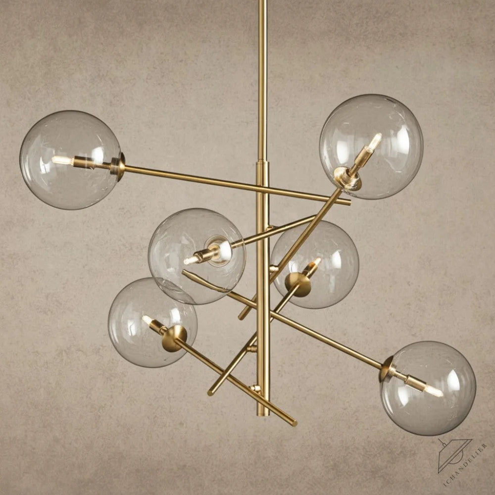 ichandelier Roscoe Chandelier, modern brass fixture with clear glass globe shades and exposed bulbs.