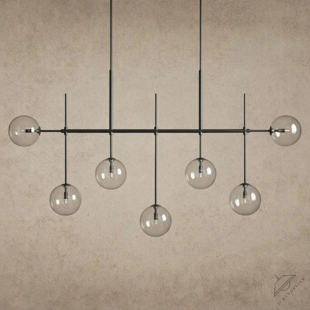 ichandelierHere 60” Roscoe Linear Chandelier with clear glass globes and black metal frame, modern design.