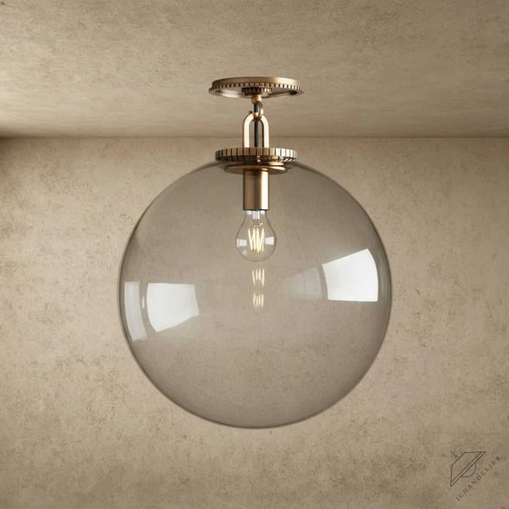 ichandelier Wescott Globe Flush Mount, clear glass shade, brass hardware, modern industrial style ceiling light.