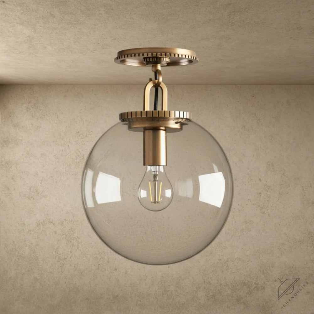 ichandelier Wescott Globe Flush Mount, clear glass shade with brass hardware and exposed Edison bulb