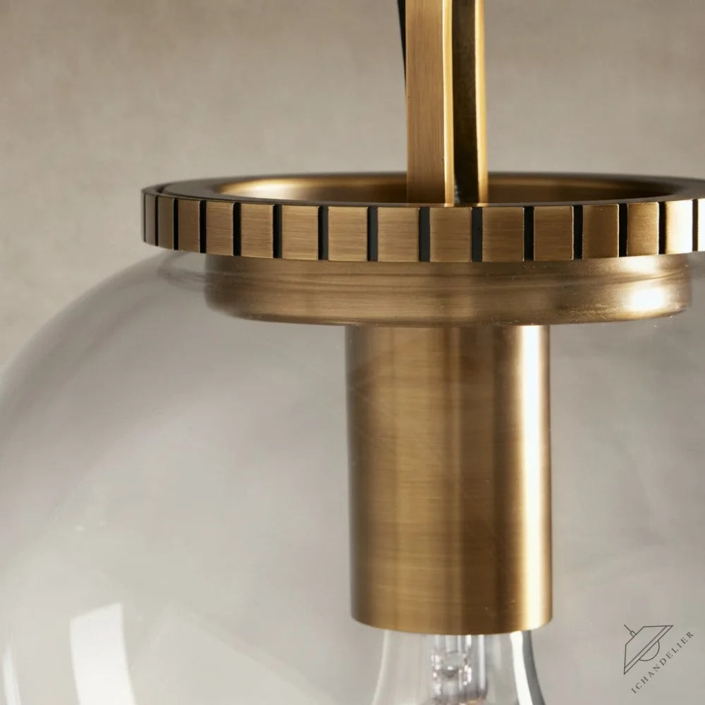 ichandelier Wescott Globe Pendant with Chain, clear glass shade with brass accents and decorative ring detail